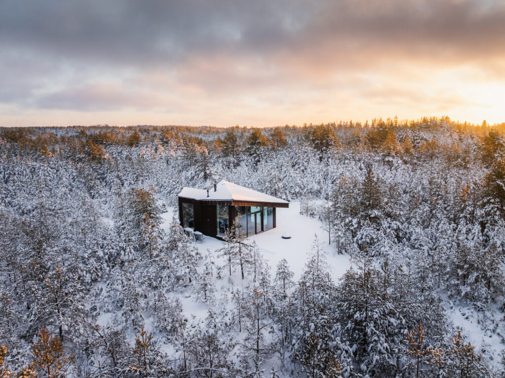 alt="Dharma Houses surrounded by snow on Muhu Island, Estonia"