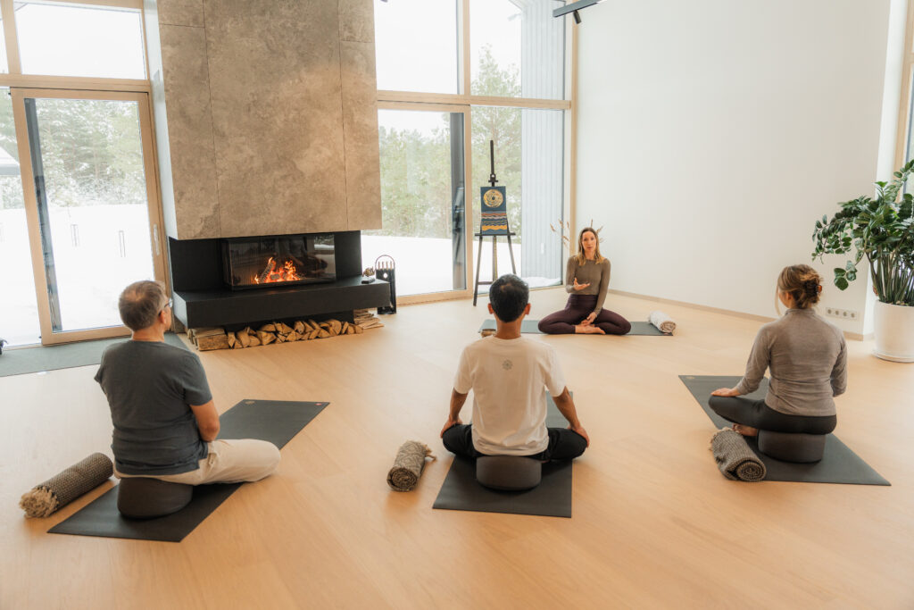 alt="Meditation session in a calm space at Dharma Resort"