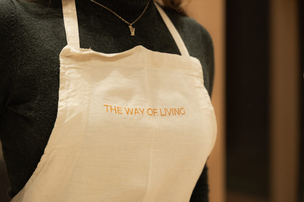 alt="Dharma Resort cooking class apron detail"